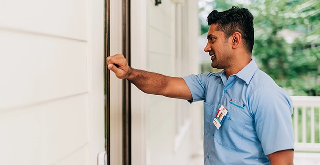 AireServ tech knocking on door.