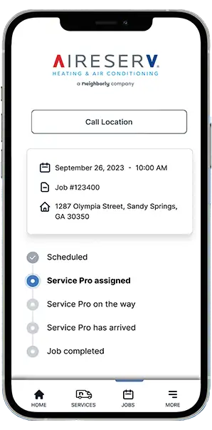 Neighborly App job progress marked 'Service Pro assigned' displayed on smartphone screen.