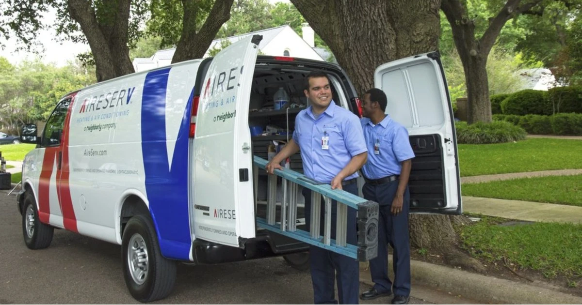 Aire Serv service professionals arriving to perform AC maintenance services in Houston, TX.