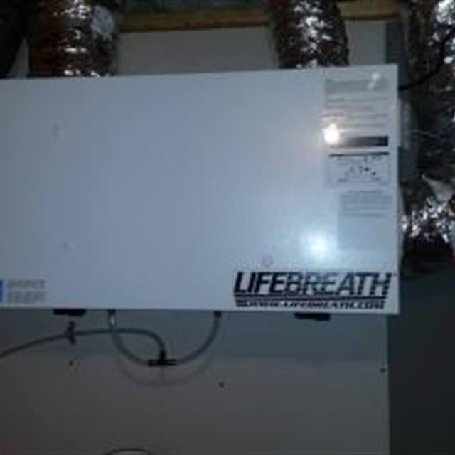 A Lifebreath heat recovery ventilator installation. Keeps the moisture and ice off the windows.