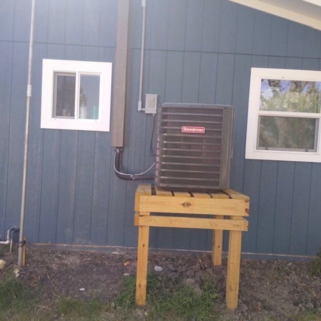 AC condenser outside on stand