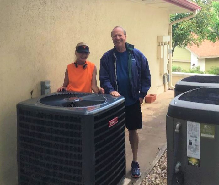 ASV technician near HVAC unit.