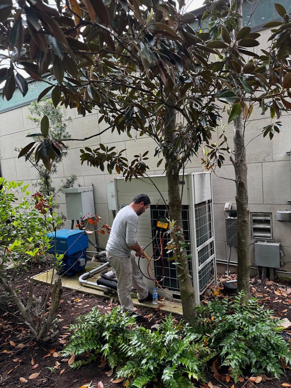 ASV technician repairing HVAC unit.