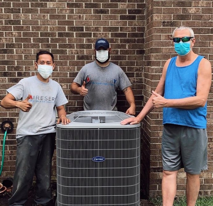 ASV technicians near HVAC unit.