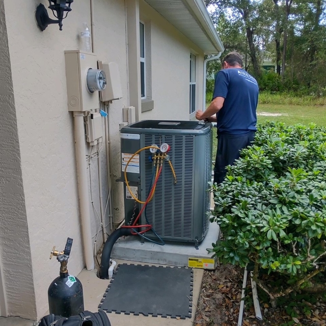 Aire Serv Technician Working on Unit