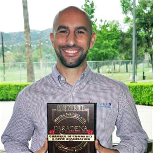 Aire Serv employee holding plaque