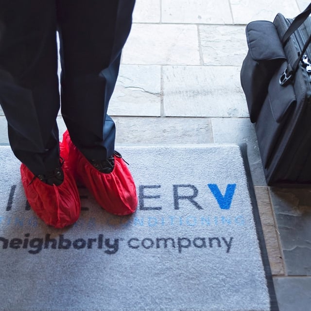 Aire Serv floor mat with red booties