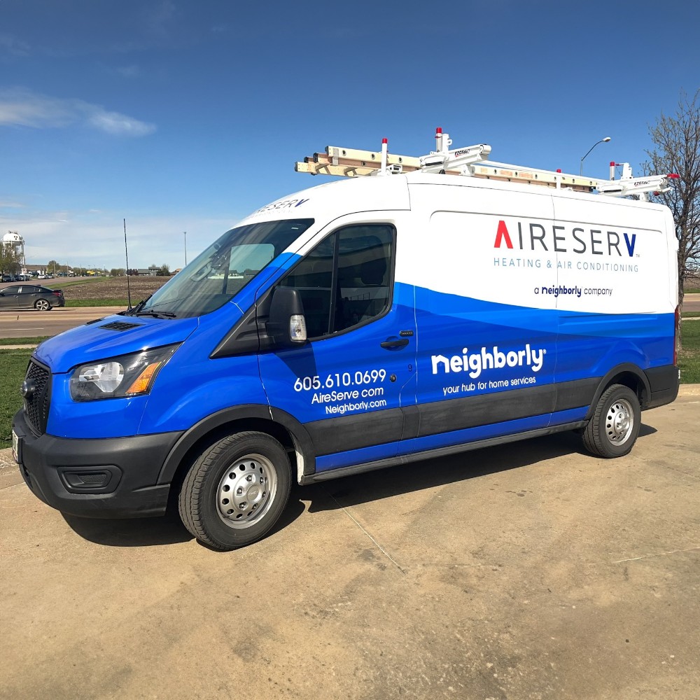 Blue and White Aire Serv Van with Logo