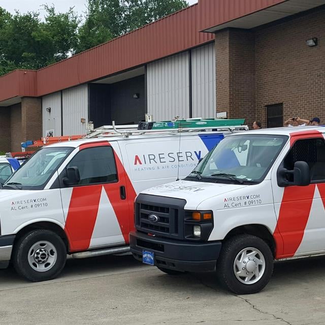 Aire Serv vehicles with logo