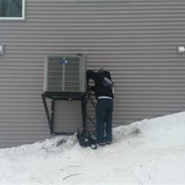 Andy installing an American Standard heat pump on Floyd Lake.