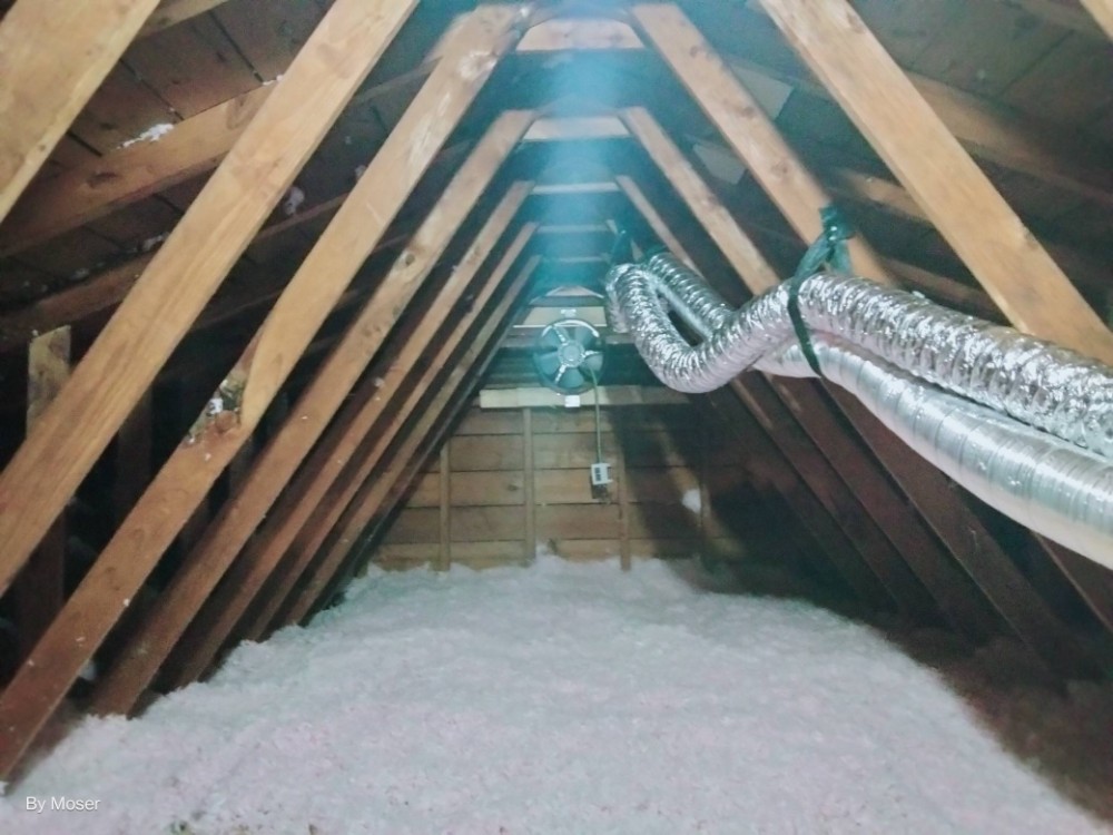 Ductwork and blown insulation in attic