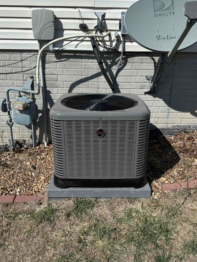 Air conditioner on the outside of a house. Work performed by Aire Serv of Council Bluffs.