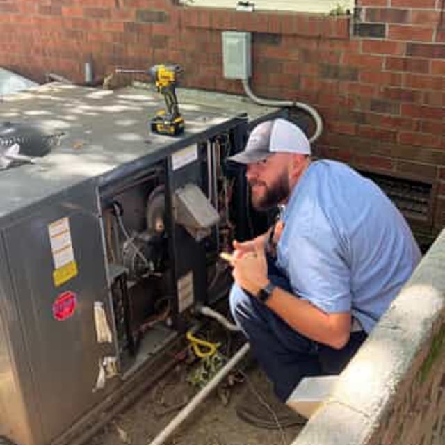 HVAC expert performs spring tune up