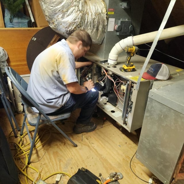 Aire Serv's service professional performs heating tune up