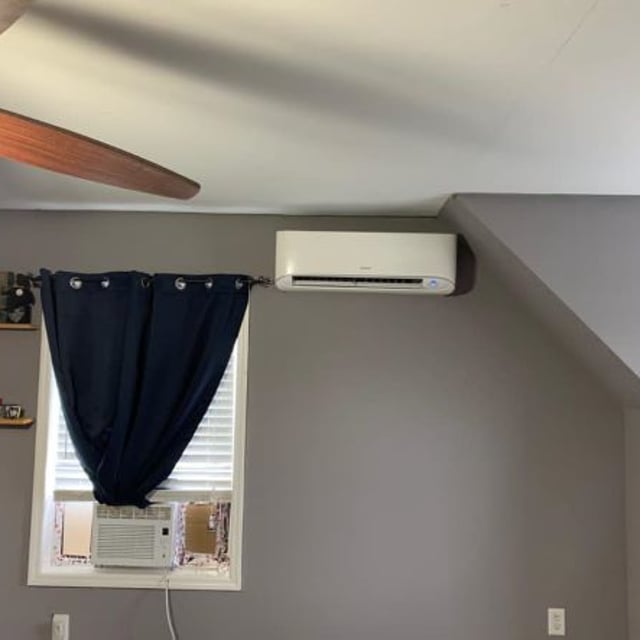 Inside bedroom with trophies on wall