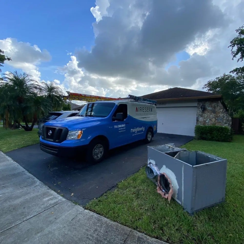 Air Serv of Fort Lauderdale van in front of a house in Weston to install an air conditioning unit