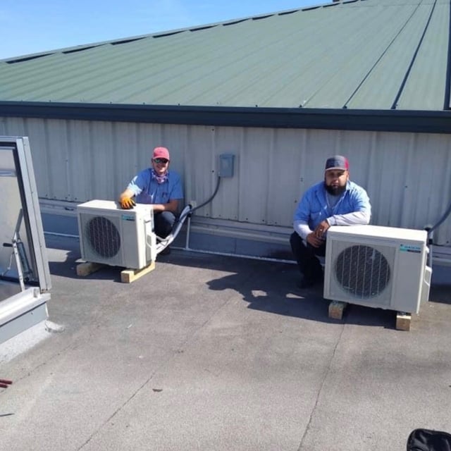 New AC condensers installed on top of building