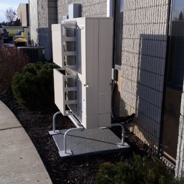 New HVAC Unit on small slab of concrete