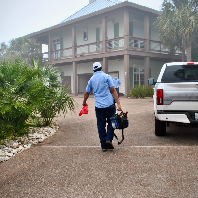 man carrying botties and a utility bag