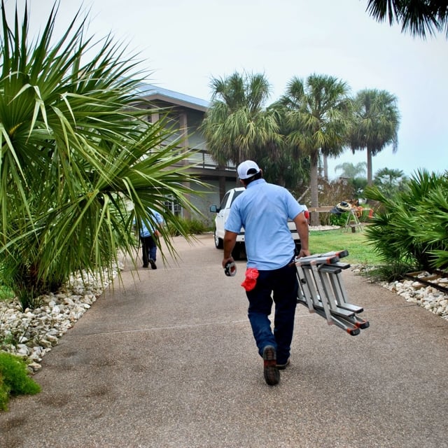 man carrying ladder