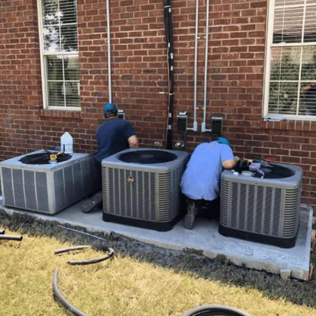 Service Professionals Working on AC Units