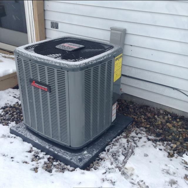 snow covered AC unit