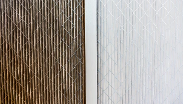 A side-by-side comparison of replacement air filters -- one dirty, one clean.