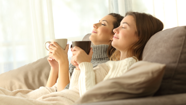 Women relaxing on a couch