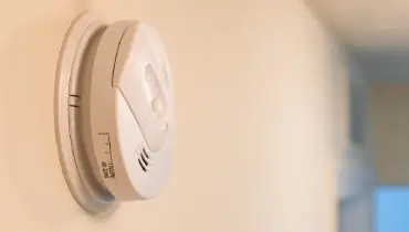 Smoke detector mounted on wall