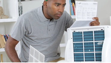 Man working with HEPA filter