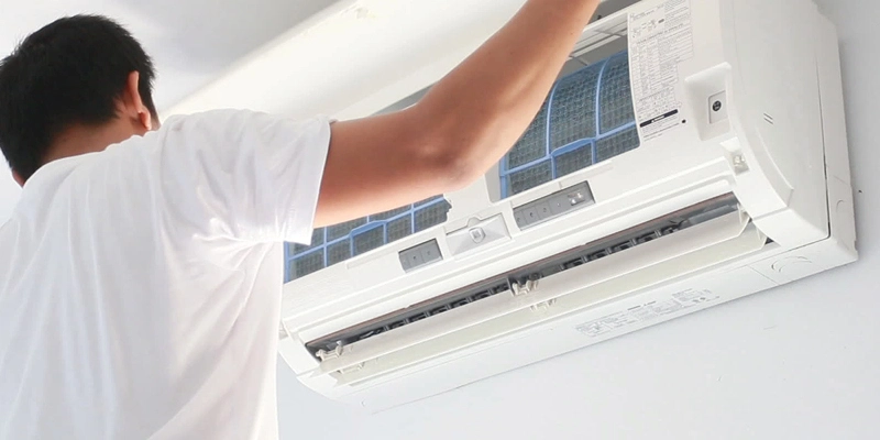 Man installing a ductless split system