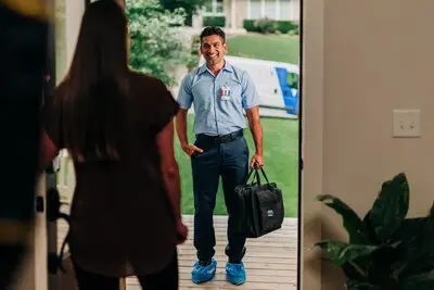 Smiling Technician greeting customers