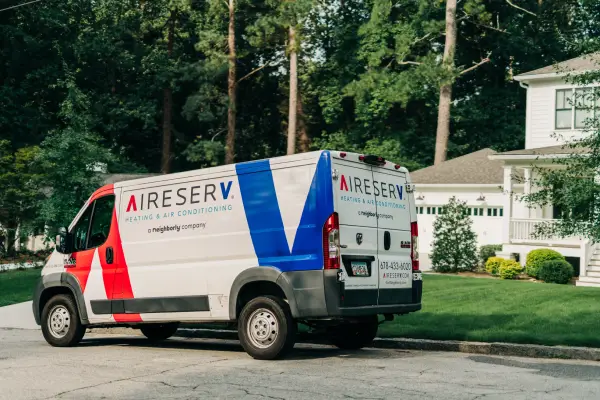 ASV branded van parked in street.